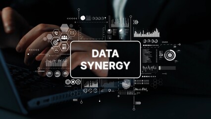 Hands on Keyboard with Digital Overlays Illustrating Concept of Data Synergy in Modern Technology...