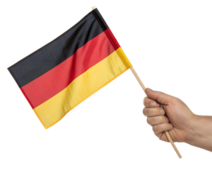 A hand holding a small flag of Germany
