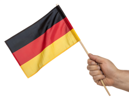 A hand holding a small flag of Germany
