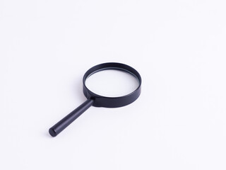 A magnifying glass isolated on a clean white background. Concepts: investigation, search, discovery, research, magnifying, solution, zoom, equipment, tool, find, inspect, analyse.
