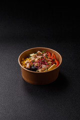 Bowl with chicken pieces, rice, tomatoes, peppers and microgreens. Bowl with chicken