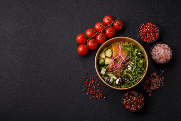 Bowl with salmon pieces, cheese, tomatoes, peppers and avocado. Salmon bowl