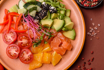 Bowl with salmon pieces, cheese, tomatoes, peppers and avocado. Salmon bowl