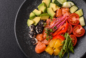 Bowl with salmon pieces, cheese, tomatoes, peppers and avocado. Salmon bowl