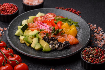 Bowl with salmon pieces, cheese, tomatoes, peppers and avocado. Salmon bowl