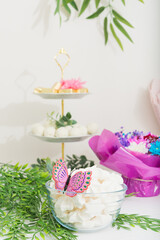 White meringue in glass vase on holiday table. Celebration concept