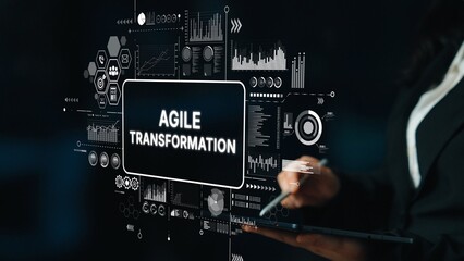 Professional Businesswoman Illustrating Agile Transformation with Digital Graphs and Data...