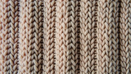 Fototapeta premium Knitted fabric texture in beige and cream colors 