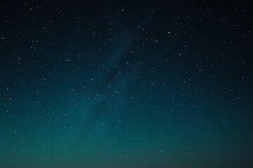 Fototapeta premium Green-blue gradient starry night sky, cosmic astronomy background with faint galaxy.