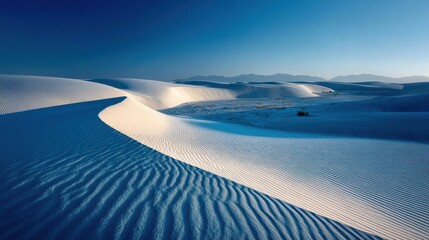 White sand dunes landscape; mountain range background; travel or nature promo