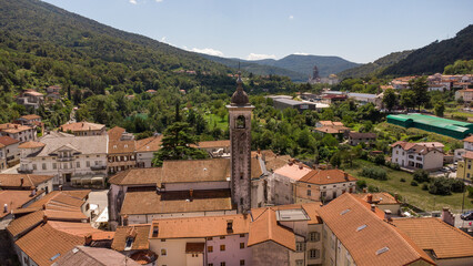Fototapeta premium Aerial View of a Quaint Town Center with Red Roofs and Nearby River