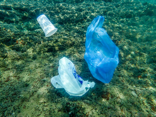 Bag in underwater, Environmental pollution problem plastic bottle in sea, Plastic rubbish garbage...