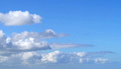 Blue sky filled with fluffy clouds