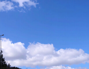 Blue sky with fluffy clouds