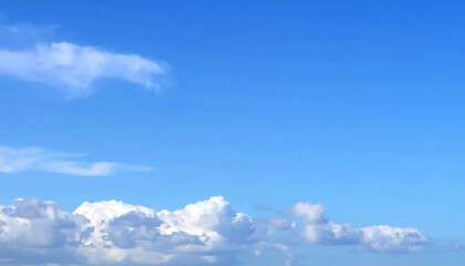 Clear sky with fluffy clouds