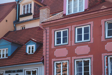 Row of houses with pink building in the middle. All houses are different colors and styles. Riga vacation travel concept