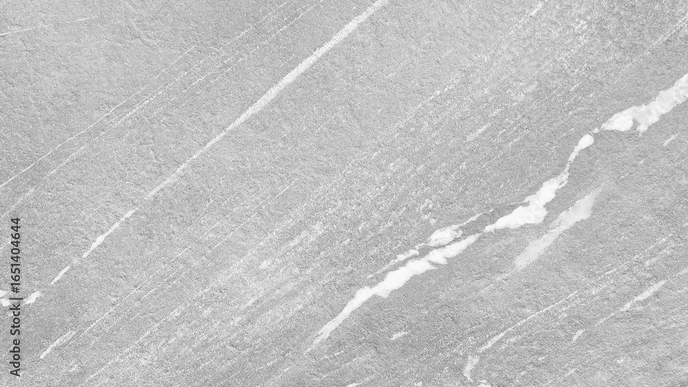 Poster white wall with rough texture. the wall is covered with small cracks and has a rough, uneven surface
