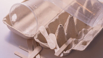 cardboard egg container and plastic bottles