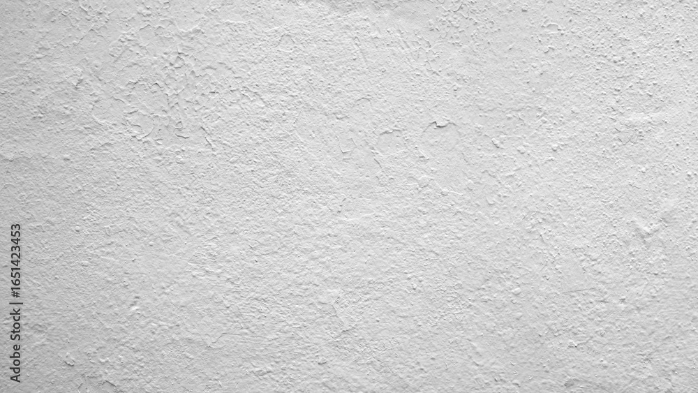 Poster white wall with rough texture. the wall is covered with small cracks and has a rough, uneven surface