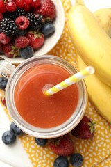 Superfood. Healthy drink in mason jar and ingredients on white wooden table, flat lay