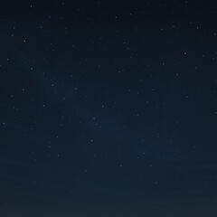 Fototapeta premium A serene night sky filled with countless stars, showcasing the vastness of the universe and the beauty of celestial bodies.