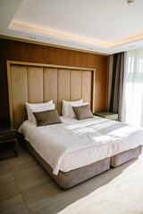 Cozy Modern Bedroom in Scandinavian Style illuminated by the sun .Nordic Design 