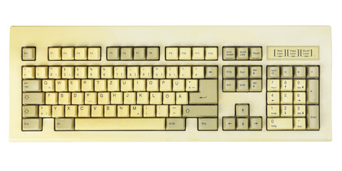 Vintage computer keyboard from the 1990s isolated on white background.