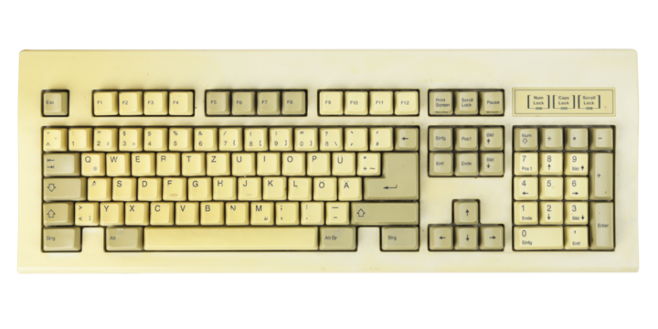 Vintage computer keyboard from the 1990s isolated on white background.