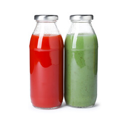 Tasty juices in glass bottles isolated on white