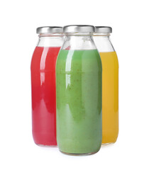 Tasty juices in glass bottles isolated on white