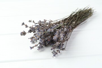 Bunch of fragrant lavender flowers on white wooden table, closeup
