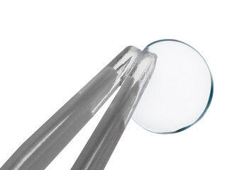 Tweezers with contact lens isolated on white