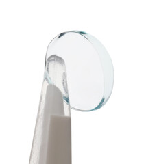 Tweezers with contact lens isolated on white