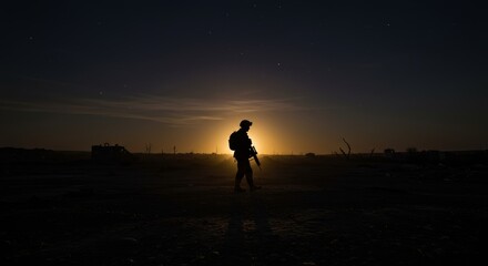 Naklejka premium Soldier Silhouette Against Night Sky in War-Torn Landscape at Dusk