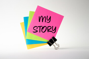 My story symbol. Pink sticky note with words My story. Beautiful white background. Business and My...