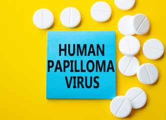 Human Papilloma Virus symbol. Concept word Human Papilloma Virus on blue note. Beautiful yellow...