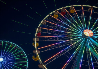 Illuminated Ferris Wheel at Night with Rainbow Lights – Carnival Celebration