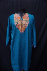 Kashmiri pheran displayed on a mannequin in Kashmir