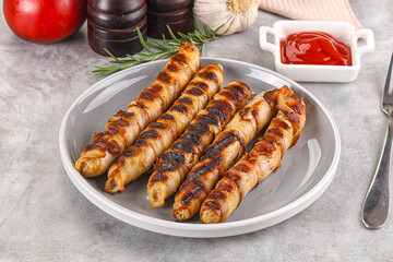 Grilled meat sausages wrapped bacon