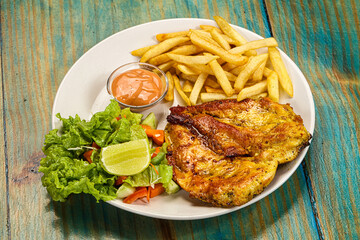 Grilled chicken fillet with french fried potato