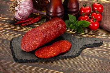 Spicy pepperoni sausages with sliced piece