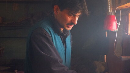 Portrait of a Kashmiri Kandur baker, known for making traditional Kashmiri bread.