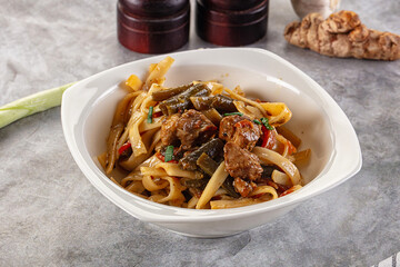Asian cuisine udon with chicken and vegetables