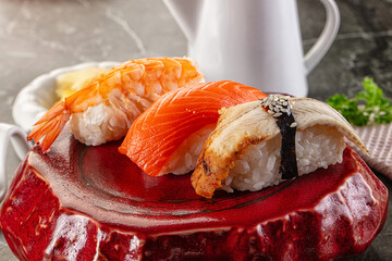 Japanese cuisine - sushi with eel, salmon and prawn