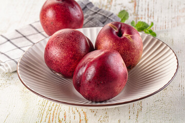 Ripe sweet juicy nectarines heap
