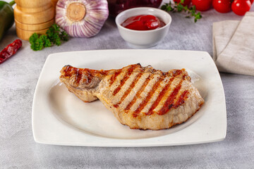Tasty hot grilled bone steak served sauce