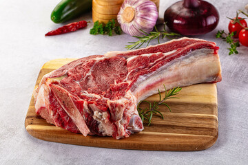 Raw prime beef steak with bone