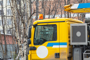Yellow cabin of technical emergency vehicle with flashing light. Close-up.