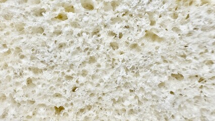 close up airy white bread texture with porous crumb pattern ideal for food background or bakery...
