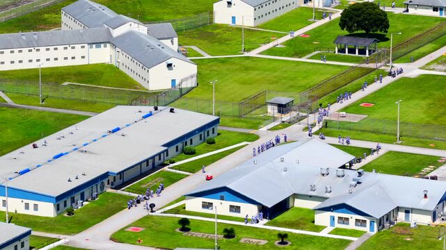Inmates in motion Homestead Correctional Institution FDC Miami stock footage